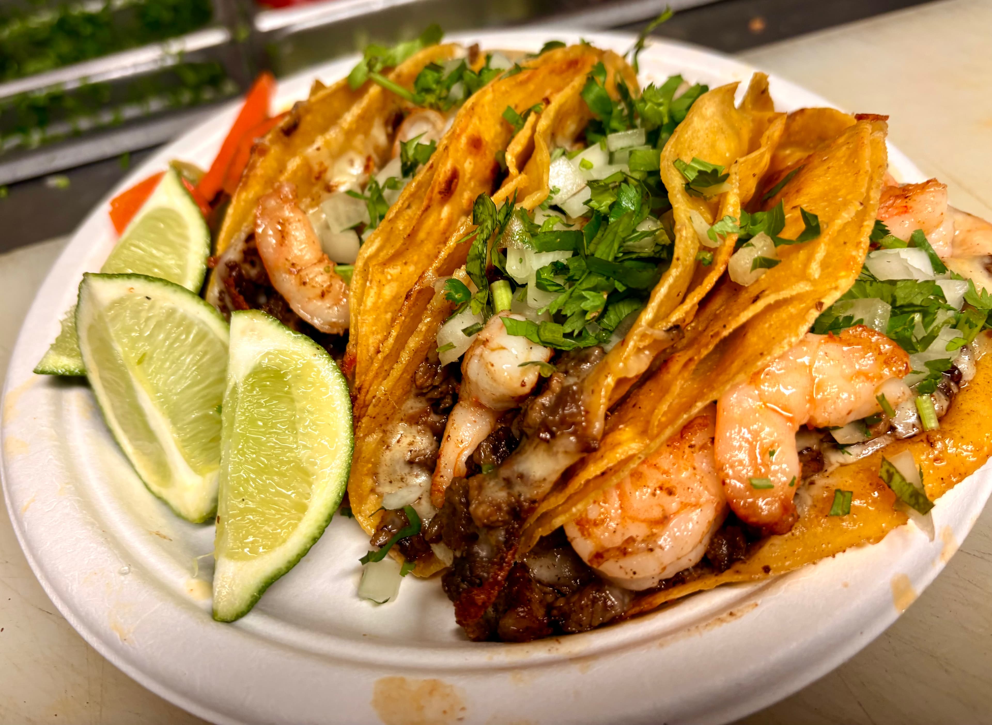 Loaded shrimp and steak tacos, close up